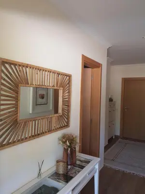 a living room with a mirror on the wall at MARINA DE ALBUFEIRA, Best Apartment in Albufeira