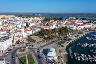 an aerial view of a city with a harbor at Privilege Deluxe Apartment Casa Mãe, Faro in Faro