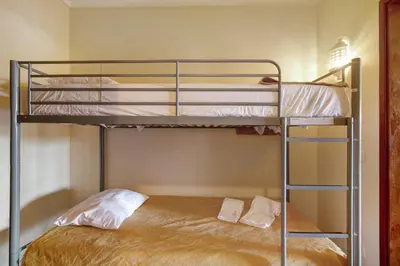 a bedroom with two bunk beds in a room at Belavista House in Albufeira