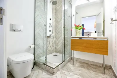 a bathroom with a shower and a toilet at Hot Breeze Apartment in Faro