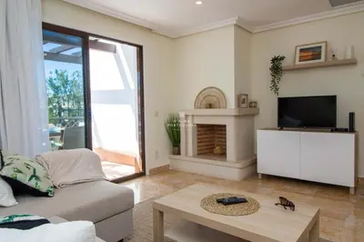 a living room with a couch and a tv at Apartment Pine View- Falesia Beach By Dalma Portuguesa in Albufeira