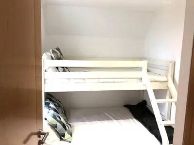 two bunk beds in a small room at The Albufeira Concierge - Moinho Pool & Gardens in Albufeira
