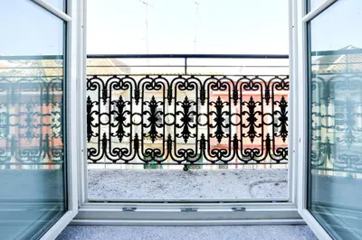 a window view of a balcony with a wrought iron fence at Offline Mood Apartment in Faro