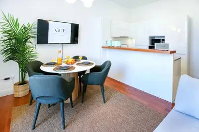a small dining room with a table and chairs at Offline Mood Apartment in Faro