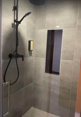 a shower in a bathroom with a glass door at Pontinha Exclusive Apartment in Faro