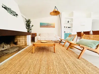 a living room with a couch and a fireplace at Amazing - VillaAnas Balaia in Albufeira