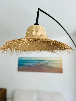 a straw lamp hanging from a wall with a picture at Amazing - VillaAnas Balaia in Albufeira