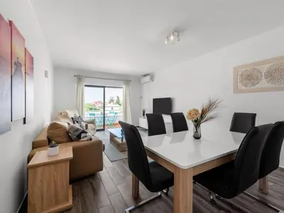 a living room with a table and a couch at Apartment Happy Moments by Interhome in Albufeira