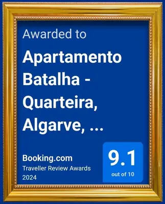 a picture of a framed sign in a gold frame at Apartamento Batalha - Quarteira, Algarve, Portugal in Quarteira