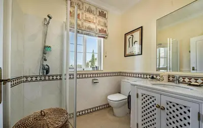 a bathroom with a shower and a toilet and a sink at Quinta do Lago 2-Bed Apartment - Golf Pool & Ac in Faro