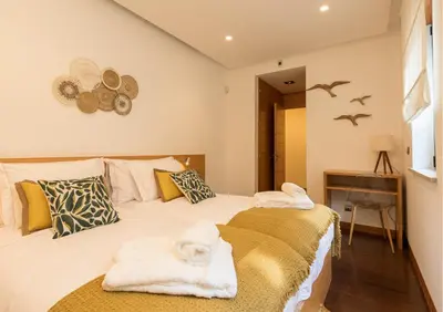 a bedroom with two beds with towels on them at Algarve: Vale Lobo Golf&Beach with Private Pool II in Almancil