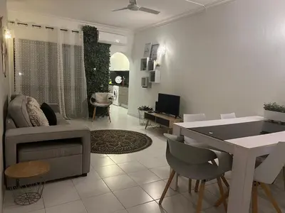 a living room with a couch and a table at Casa da Praia - Santa Eulália Beach in Albufeira