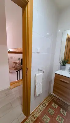 a bathroom with a sink and a toilet in a room at Mezzanine 4 Faro in Faro