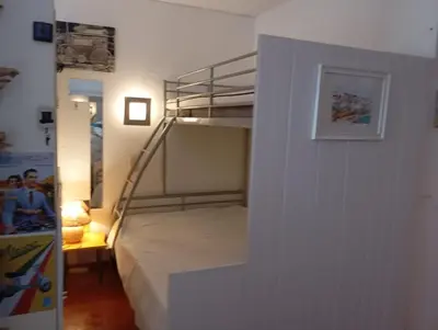 a bedroom with a bunk bed in a room at Albufeira Home in Albufeira