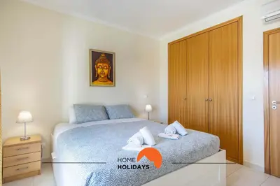 a table and chairs on the balcony of a apartment at #107 T1 Vista das Ondas by Home Holidays in Albufeira