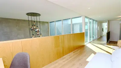 an office lobby with a reception desk and chairs at Villa Miya - Clever Details, walking distance from the Marina, restaurants, bakeries and supermarkets,, free wifi, pool in Vilamoura