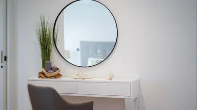 a white dressing table with a mirror on a wall at Apartment Terracos do Mar - By Dalma Portuguesa in Quarteira