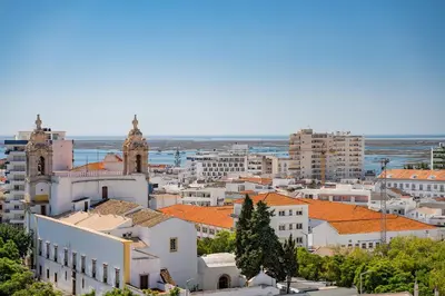 a city with white buildings and orange roofs at My Place @ Faro Skyline in Faro