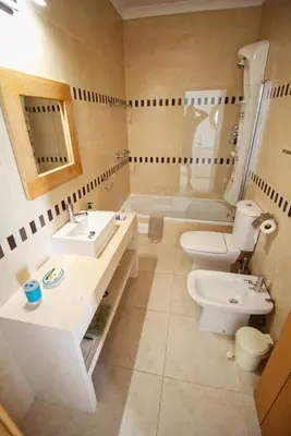 a bathroom with a toilet and a sink and a tub at Excellent Sea view 1 Bedroom Apartment, Verandas do Mar, Olhos de Agua AT05 in Olhos de Água