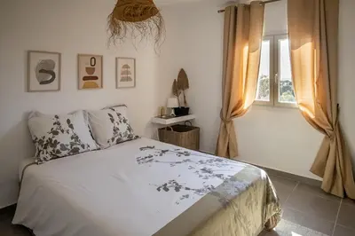 a bedroom with a bed and a window at Loft Quinta da Balaia - Jacuzzi - By BEDZY in Albufeira