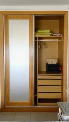 a cabinet with a sliding door in a kitchen at Quinta da Barracuda Prime Sea View Apartment in Albufeira