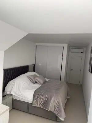 a bedroom with a large bed in a room at Vila Golf in Vilamoura
