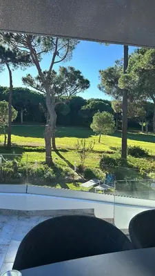 a view of a park from a window at Vila Golf in Vilamoura
