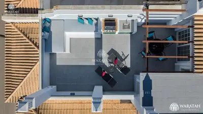 an overhead view of a house with a pool at Apartment Kairi in Vale do Lobo