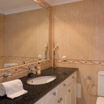 a bathroom with a sink and a mirror at Apartment Kairi in Vale do Lobo