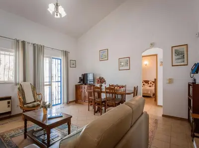 a kitchen with white cabinets and a table in it at Luxury Algarve Villa 3 Bedrooms Casa Martins Private Pool Rural Setting Loule in Loulé