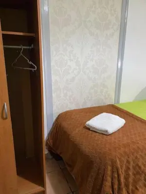 a bedroom with a bed with a towel on it at The Tiles House in Faro