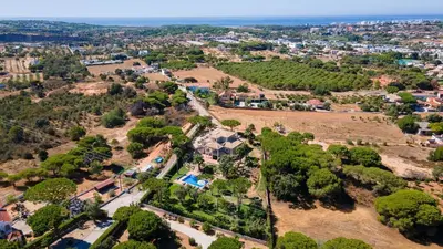 an aerial view of a town with trees and houses at Luxuosa moradia V5 em Quarteira - Greice Homes in Quarteira