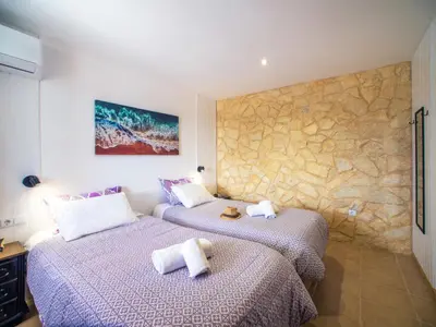 a living room with a couch and a table at Holiday Home Ana by Interhome in Paderne