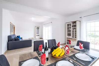 a dining room with a table with bananas on it at Villa Bahia by Algarve Vacation in Albufeira