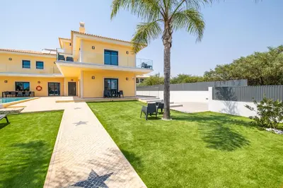a view of a house with a yard at Villa Coral Bay by Algarve Vacation in Albufeira