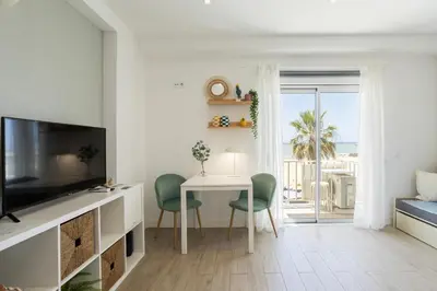 a living room with a view of the ocean at Centralgarve - Stunning Beach Front Studio - Astro in Quarteira