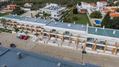an aerial view of a large white building at Albufeira Stylish Townhouse in Albufeira