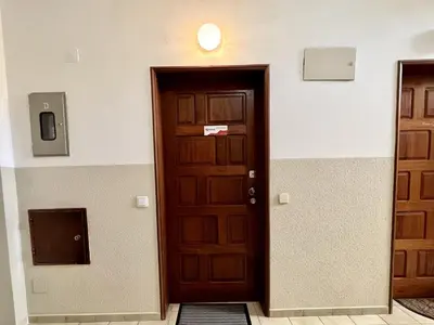 a wooden door in a room with a wall at Albufeira Downtown With Pool by Homing in Albufeira