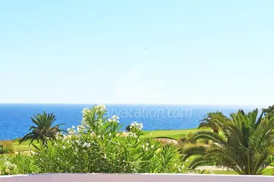 a view of the ocean from the balcony of a resort at Villa Seaside in Vale do Lobo