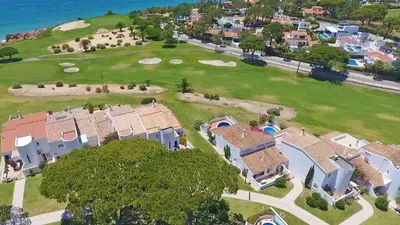 an aerial view of a house and a golf course at Villa Seaside in Vale do Lobo