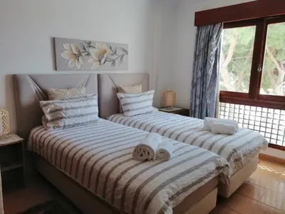 two beds sitting next to each other in a room at Apartment 3 persons in Vilamoura, Algarve in Quarteira