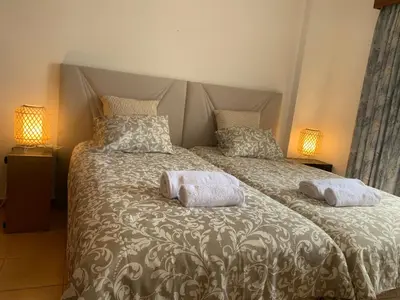 a bedroom with a bed with two pillows on it at Apartment 3 persons in Vilamoura, Algarve in Quarteira