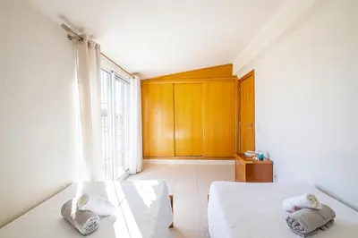 a bedroom with two beds and a window at Villa Dorado by Algarve Vacation in Albufeira