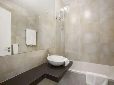 a bathroom with a sink and a tub with a toilet at Beautiful Algarve Villa 5 Bedrooms Villa Pilar Amazing Beach & Sea Views in Albufeira
