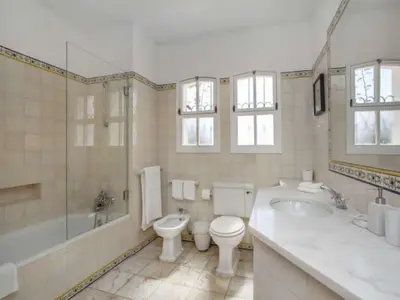 a bathroom with a tub and a toilet and a sink at Beautiful Algarve Villa 5 Bedrooms Villa Pilar Amazing Beach & Sea Views in Albufeira