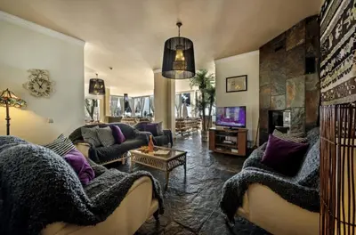 a large living room with couches and a tv at Amazing Portuguese Villa Villa Heroine 6 Bedrooms Stunning Position in Albufeira