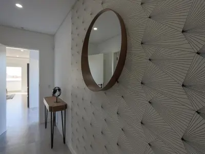 a mirror on a wall in a room with a table at Luxury Penthouse Apartment Private Jacuzzi, Albufeira in Albufeira