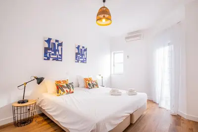 a white bedroom with a large bed in a room at Villa Amaris by Atlantic Places in Albufeira