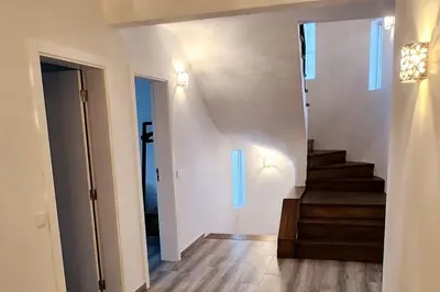 a hallway with a staircase in a house at Villa Garden - 22 Guests - 2 Pools in Albufeira