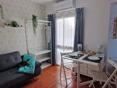 a living room with a couch and a table at Paulo's 104 in Albufeira